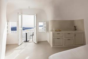 CASASUNSHA Hybrid Retreat Santorini 객실 침대