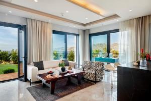 a living room with a couch and a table at Root Redrock Yalıkavak in Yalıkavak