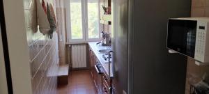 a small kitchen with a sink and a window at La casa di Gianfri in Esanatoglia +22 photos