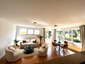a living room with a couch and a table at Wolu suites in Brussels