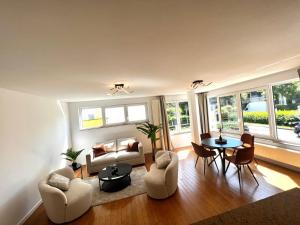 a living room with a couch and a table at Wolu suites in Brussels