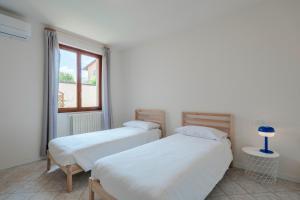 Ένα ή περισσότερα κρεβάτια σε δωμάτιο στο La Casa di Giuliano