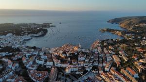 an aerial view of a city with a harbor at Hotel Boutique Es Blau in Cadaqués