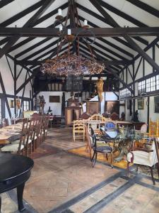 a dining room with a table and chairs and a chandelier at Rustic Charm a Unique and Antique Apartment in Zagreb