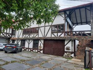 a house with a car parked in front of it at Rustic Charm a Unique and Antique Apartment in Zagreb