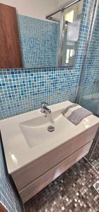 a bathroom with a sink and a mirror at Villa Dimitra in Agios Dimitrios