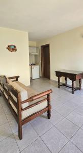 a room with two benches and a pool table at Villa Dimitra in Agios Dimitrios