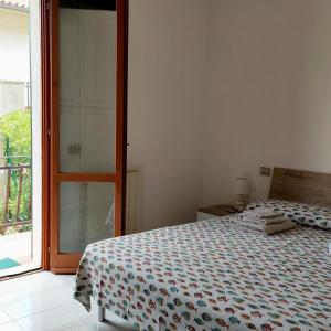 Posteľ alebo postele v izbe v ubytovaní Appartamento Castiglioncello 500 mt dal mare