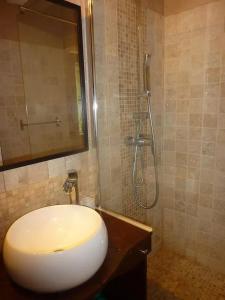 a bathroom with a sink and a shower at Maison charmante à Les Junies avec vue sur jardin in Les Junies +15 photos