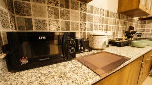 Kuchyň nebo kuchyňský kout v ubytování Walisons Homestay Abelia