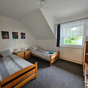 Posteľ alebo postele v izbe v ubytovaní Apartament 112