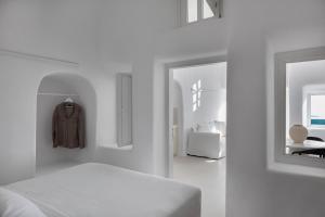 CASASUNSHA Hybrid Retreat Santorini 객실 침대