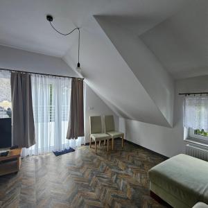 Televízia a/alebo spoločenská miestnosť v ubytovaní Apartament 112 + 8 fotografií
