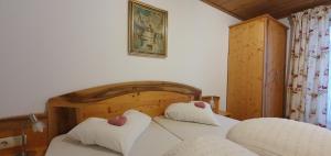 Postel nebo postele na pokoji v ubytování Gästehaus Watzmannblick