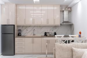 Kuchyň nebo kuchyňský kout v ubytování Meraki Home