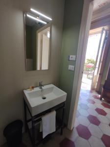 a bathroom with a sink and a mirror at B&B Don Antonio in Civitella Casanova