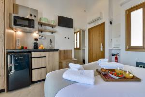 a kitchen with a table with a tray of food on it at MIMAR ALTEA ROOMS - Tranquil in Altea