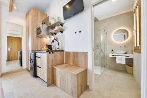 a small kitchen with a sink and a shower at MIMAR ALTEA ROOMS - Tranquil in Altea