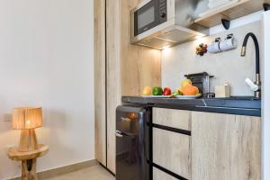 a kitchen with a counter with fruits on it at MIMAR ALTEA ROOMS - Tranquil in Altea