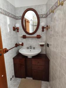 a bathroom with a sink and a mirror at La Belle Epoque in Gubbio +11 photos