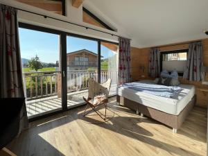 A bed or beds in a room at Chalet Charivari Inzell