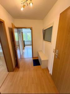 an empty room with a door and a hallway at Entspannungs Oase in Striegistal