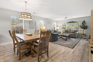 a dining room and living room with a table and chairs at 55A 4th Hole Retreat at True Blue condo by Peace Vacations in Pawleys Island