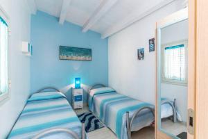 Ένα ή περισσότερα κρεβάτια σε δωμάτιο στο Vista Mare tra i luoghi di Montalbano