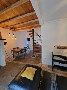 a living room with a couch and a table at Casas e Glamping Quinta da Saudade in Canha