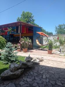 a building with a playground in a yard at Vila Flory & Crystiana in Costinesti