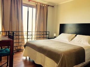 Postel nebo postele na pokoji v ubytování Yemanya Hostal