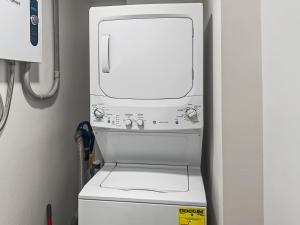 a white washer and dryer in a room at ETW#6004-Penthouse Beachfront Condo–Amazing Views in Fort Walton Beach