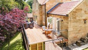 an aerial view of a house with a wooden deck at Sandsend Retreats at Saltmoore in Sandsend