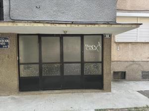 a store window with graffiti written on it at The Great Escape in Bitola