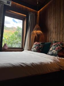 A bed or beds in a room at Dar Elrio
