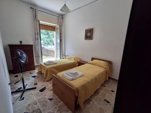 Postel nebo postele na pokoji v ubytování Pomelia Home + 2 fotografie
