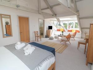 Ένα ή περισσότερα κρεβάτια σε δωμάτιο στο Eider Cottage