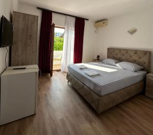 Voodi või voodid majutusasutuse Rooms Ajllin toas