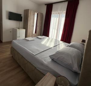 Voodi või voodid majutusasutuse Rooms Ajllin toas