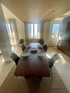 a dining room with a table and chairs in it at Casa di Giulia in Lovere +29 photos