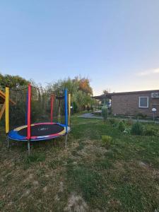 a playground with a trampoline in a yard at Kambodzha na Dynae in Vylkove