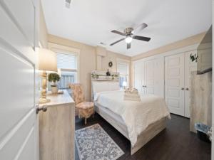 a bedroom with a bed and a ceiling fan at Blue Snapper condo in Carolina Beach