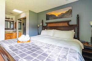 a bedroom with a bed with white shoes on it at ArtLens Casa in Schertz