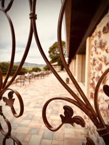 a close up of a wrought iron gate with a patio at La Quinta Luxury Palace in Arnuero