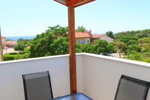 a view from the balcony of a house at Pansion Comfort Sidro in Novalja