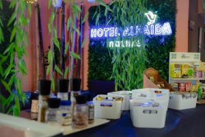 a table with boxes of food on it with plants at Hotel Albaida Nature in Mazagón