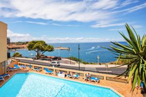 a swimming pool with a view of the ocean at Résidence Les Balcons de Collioure - maeva Home - Studio 4 Personnes Confort MAE-5972 in Collioure