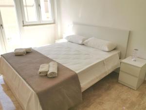 En eller flere senge i et værelse på Eva D'Estate Casa Vacanze Salento