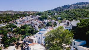 an aerial view of a town with white buildings at Serenity apartment in Kóronos +5 photos
