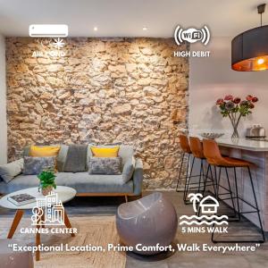 een weergave van een woonkamer met een stenen muur bij Luxury Family 2BR - Prime Location, Walk to Beach & Shopping, Sunny Balcony - By Totolulu Cannes Hoche in Cannes